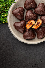 Gingerbread chocolate heart shaped honey cakes Christmas sweet dessert new year natural product tasty snack fresh delicious gourmet food background on the table rustic top view copy space