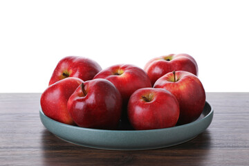 Ripe red apples on wooden table against white background, closeup