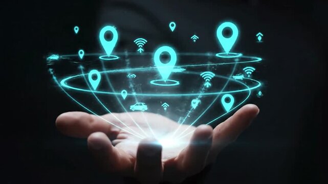 Close up of hand displaying holographic GPS icons for real time navigation and tracking