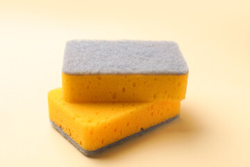 Clean kitchen sponges on beige background, closeup