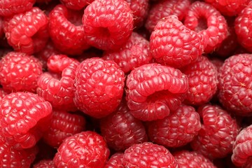 Fresh ripe raspberries as background, closeup view