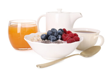 Healthy breakfast. Oatmeal with berries, yoghurt, tea and juice isolated on white