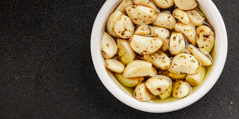Garlic slices in flavored oil roasted garlic slice in oil fast food natural tasty appetizer fresh...
