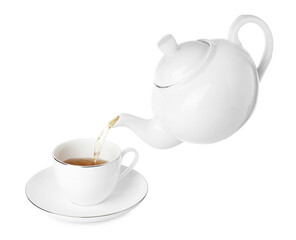 Pouring hot tea into cup from teapot on white background