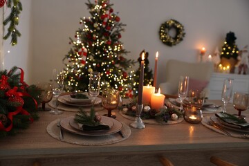 Festive table setting with Christmas decor indoors, closeup