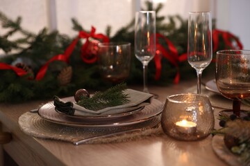 Festive table setting with Christmas decor indoors, closeup