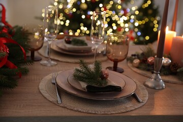 Festive table setting with Christmas decor indoors, closeup