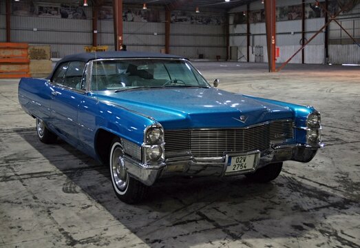 Blue Cadillac DeVille convertible vintage car in warehouse