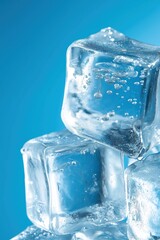 Obraz premium Close up of ice cubes on blue background, clear frozen water crystals with refreshing cool atmosphere and detailed texture for design use.