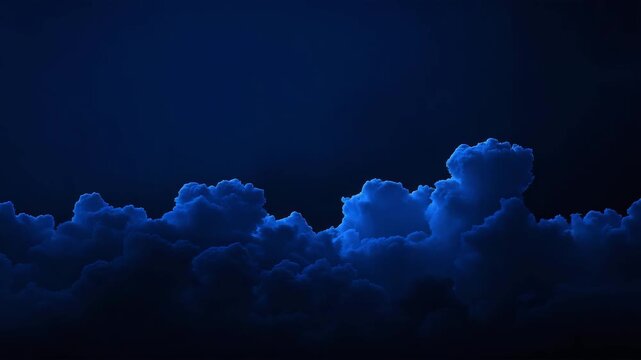 Full moon rising behind dramatic night clouds