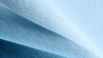 Aerial view of icy terrain with shadows creating a layered effect in shades of blue and white tones