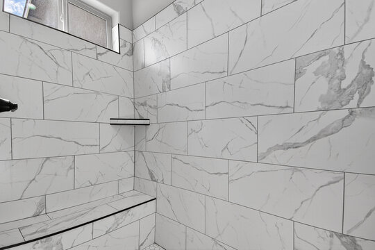 Elegant Modern Bathroom, Minimalist Marble Shower Featuring Natural Lighting And Precise Craftsmanship