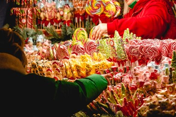 Stall or stand with traditional colorful and festive candies and lollipops at the Christmas Market