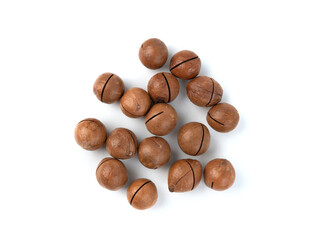 Macadamia nuts isolated. Natural raw peeled macadamia seeds and shells