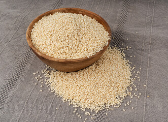 Sesame seeds pile closeup, white small benne grains. Sesamum indicum fruits