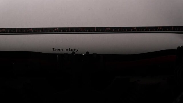 Vintage typewriter producing text with the words love story on a sheet of white paper, symbolizing romance, communication, creative writing, and nostalgic storytelling