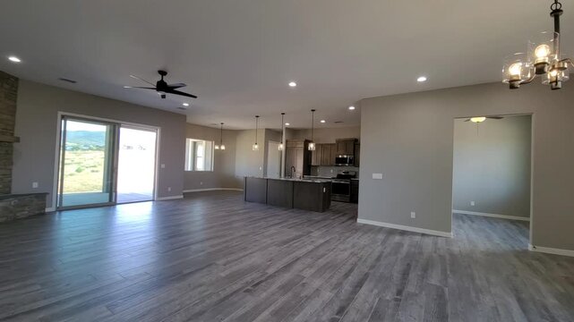 Spacious Cozy Gathering, Relaxing Family Living Area With Sliding Glass Doors And Chandelier Lighting