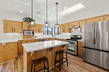 Spacious Culinary Space With Island, Familyoriented Kitchen Featuring Modern Appliances And Seating