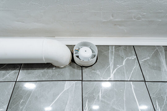 industrial system with visible conduits, ceilingbased ventilation and piping with sensors present, white pvc pipes and fittings integrated into ceiling with sensors and pathways