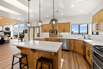 Contemporary Culinary Space, Modern Culinary Zone Featuring Large Marble Surface And Pendant Lights
