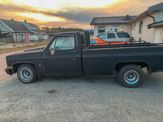 Fototapeta premium Vintage Black Pickup Truck at Sunset
