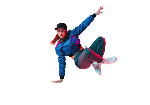 Highly athletic young caucasian b-girl executing an air flare freeze, wearing a blue satin bomber jacket; dramatic pink/blue split lighting on a reflective white cyc wall. Concept of explosive street