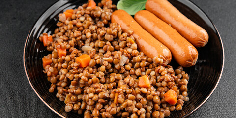 Lentils with sausage second course quick meal natural tasty appetizer fresh delicious gourmet food background on the table rustic top view copy space