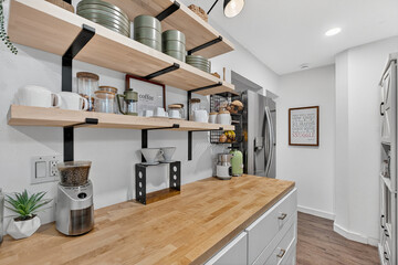 elegant kitchen organizing, wellarranged kitchen space featuring glass jars and natural lighting