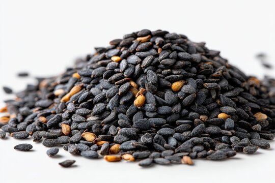 Pile of black cumin seeds on white background showing spice used in Middle Eastern and Indian cooking