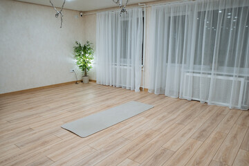 relaxing space designed for gentle yoga practice, peaceful and harmonious yoga setting that promotes relaxation and inner calmness through natural elements and subtle lighting