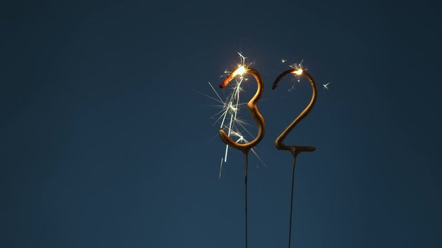 32 years celebration festive background made with Bengal fires in the form of number Thirty two.