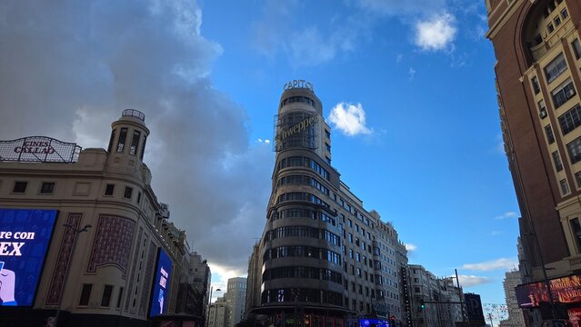 MADRID, SPAIN - DECEMBER, 2, 2025. Urban architecture and skyscrapers in Madrid's Gran Via street. Edificio Carrion with a historic Schweppes advertising sign