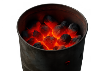 Charcoal briquettes glowing with intense heat inside a barbecue chimney starter, transparent background