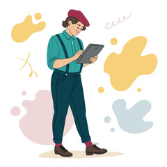 Una persona creativa con boina y tablet digital dibuja mientras est&aacute; de pie, rodeada de formas coloridas.
