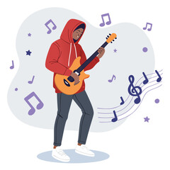 Un joven con sudadera con capucha toca una guitarra el&eacute;ctrica, rodeado de notas musicales y ambiente creativo.
