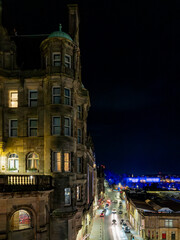 A night view of the historic Scotsman Hotel building in Edinburgh, Scotland