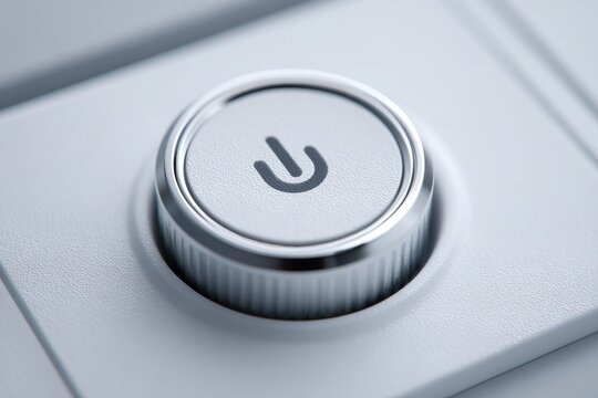Modern ignition spark button with power symbol represents technological innovation and user interface design in automotive and electronic products