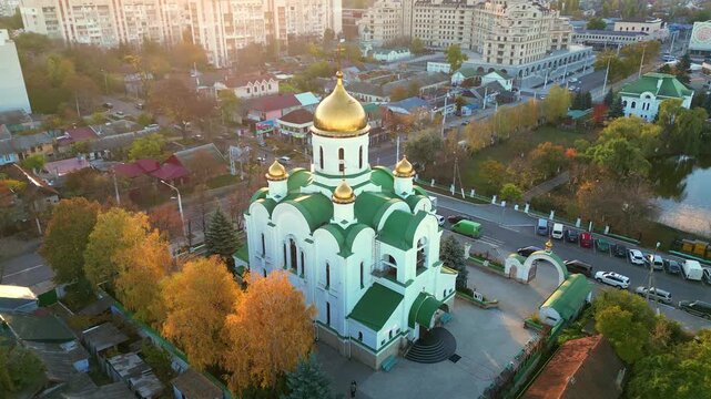 Aerial orbiting shot of Orthodox cathedral in Tiraspol Transnistria at sunset