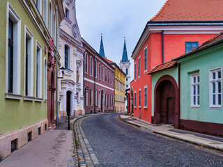 Fototapeta premium Charming cobblestone street with colorful houses in Esztergom, Hungary
