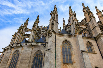 Gothic architecture of st. barbara s church facade with dramatic spires under blue sky