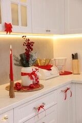 Christmas decor on countertop in kitchen, closeup. Interior design