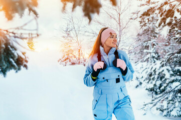 Beautiful caucasian women posing in winter sports clothing during sunset in Lapland