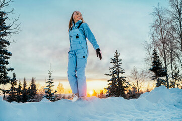 Beautiful caucasian women posing in winter sports clothing during sunset in Lapland