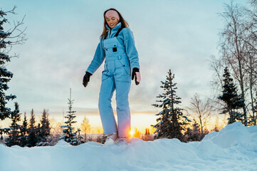 Beautiful caucasian women posing in winter sports clothing during sunset in Lapland