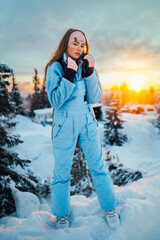 Beautiful caucasian women posing in winter sports clothing during sunset in Lapland