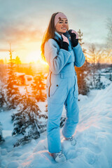 Beautiful caucasian women posing in winter sports clothing during sunset in Lapland