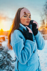 Beautiful caucasian women posing in winter sports clothing during sunset in Lapland