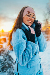 Beautiful caucasian women posing in winter sports clothing during sunset in Lapland