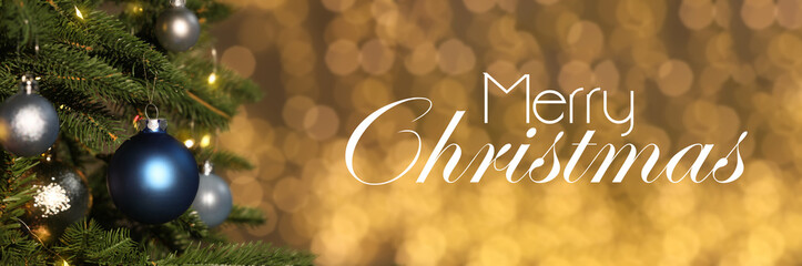 Merry Christmas and Happy winter holidays. Greeting card with fir tree, festive ornaments and bokeh lights on golden background
