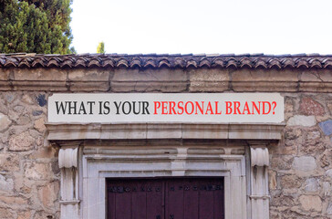 Obraz premium What is your personal brand symbol. Concept words What is your personal brand on white marble sign plate. Beautiful stone wall background. Business what is your personal brand concept. Copy space.